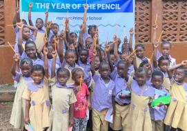 Students with their new pencils Students with their new pencils