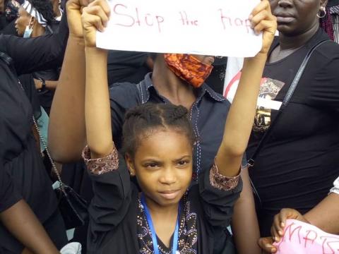 A child protesting against rape