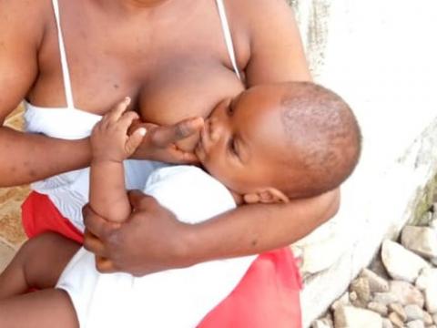 A Sierra Leonean mother breastfeeding her baby
