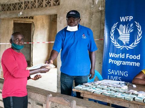 A beneficiary receiving his cash