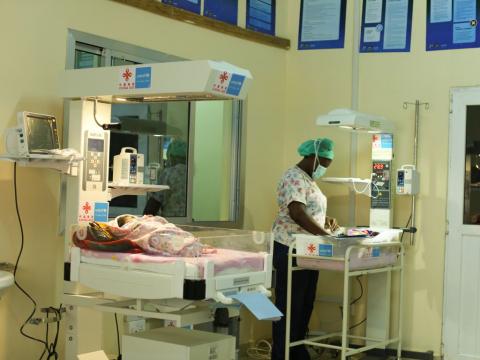 A nurse attends to a baby in the Kailahun SCBU