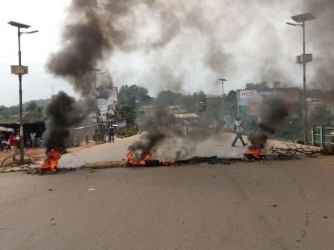 Burning tyres on the main highway in Bo