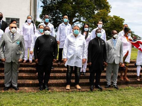 Cuban medics pose with President Bio after the meeting at State House