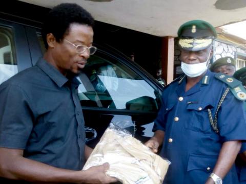 Deputy director General handing the items to the NYSC officials