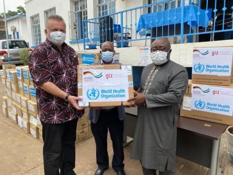 GIZ and WHO representatives handover donated items to Chief Medical Officer, Rev. TT Samba