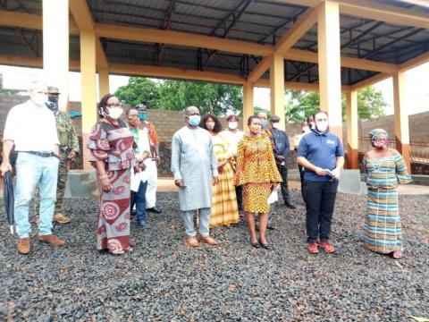 Lamina and Aki-Sawyerr and other officials pose for a photo at one of the sites.jpg