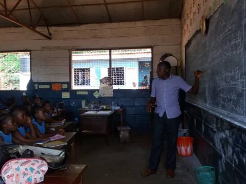 Patrick Kamara teaching PHE to class V pupils at Forum for African Women Educationalist Primary School