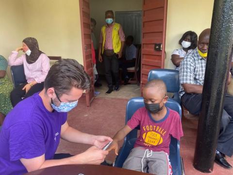 Nathan Macabung fitting Abdul Karim Kabia's upper limb prosthesis