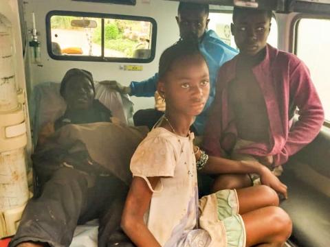 Some of the victims of the Madina violence been carried in an ambulance.