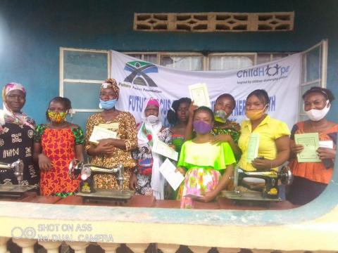 Some of the women pose with the machines