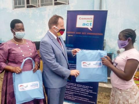 The German ambassador presenting the gifts to the children in Bo