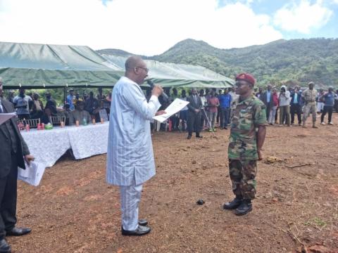VP, Dr. Juldeh Jalloh handing over the land document to a military officer